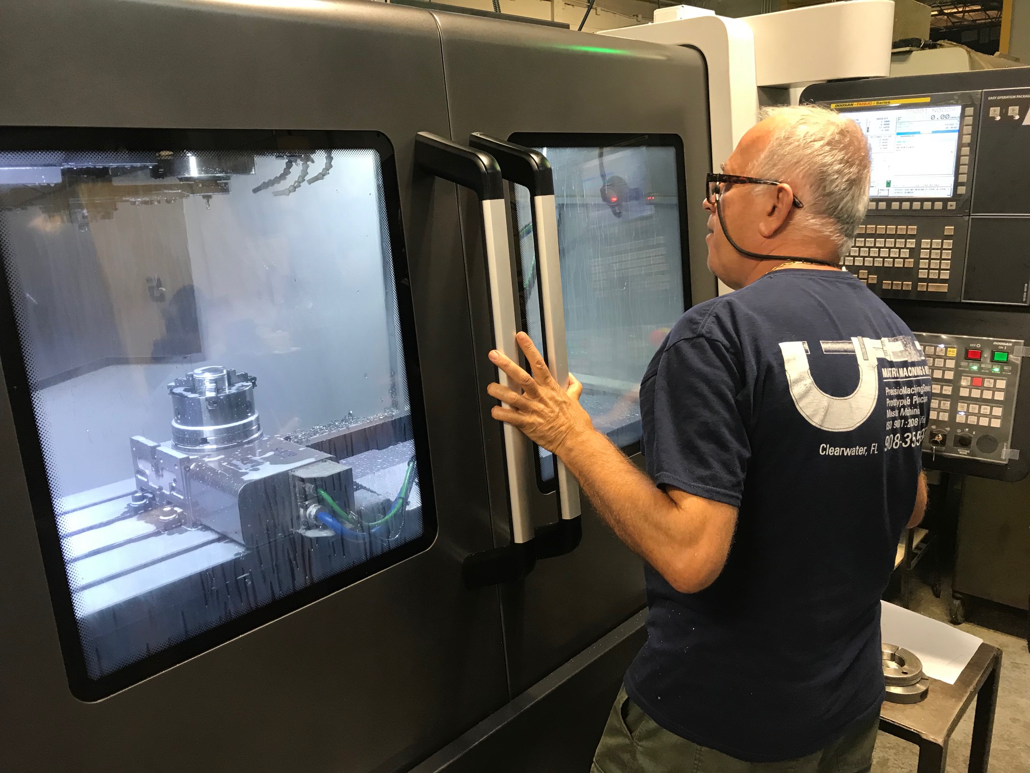 Shop-floor CNC operator at a machining center